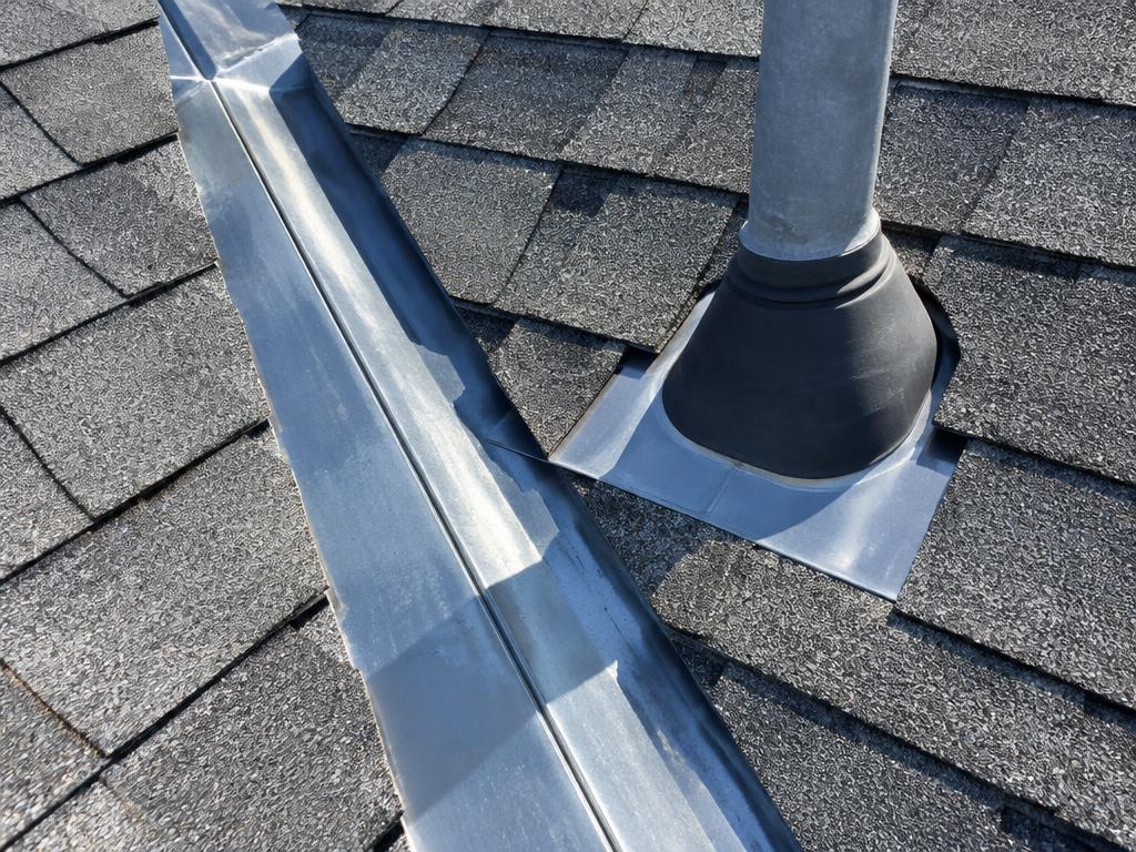 Roof valley flashing and vent pipe boot, common leak sources on Texas roofs